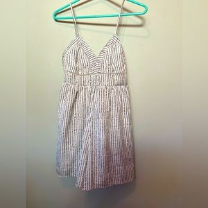 Japna size S, shorts romper, white with black detailing.